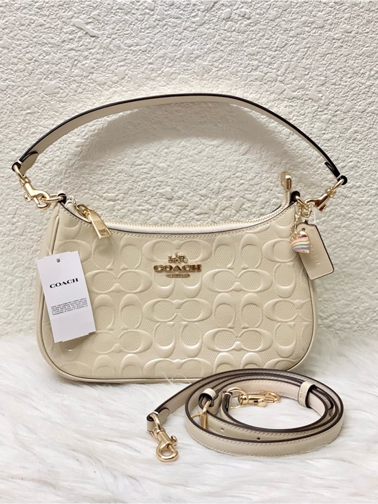 Coach Handbags - NWT Coach Teri Shoulder Bag In Signature Leather With Heart Charm in Chalk CDA98